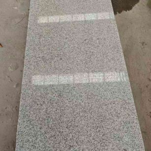 安顺芝麻白光面毛板